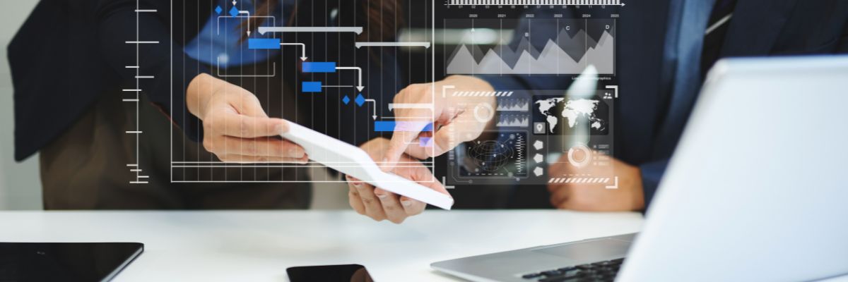 A digital Gantt chart and data overlay displayed on a tablet held by two people.